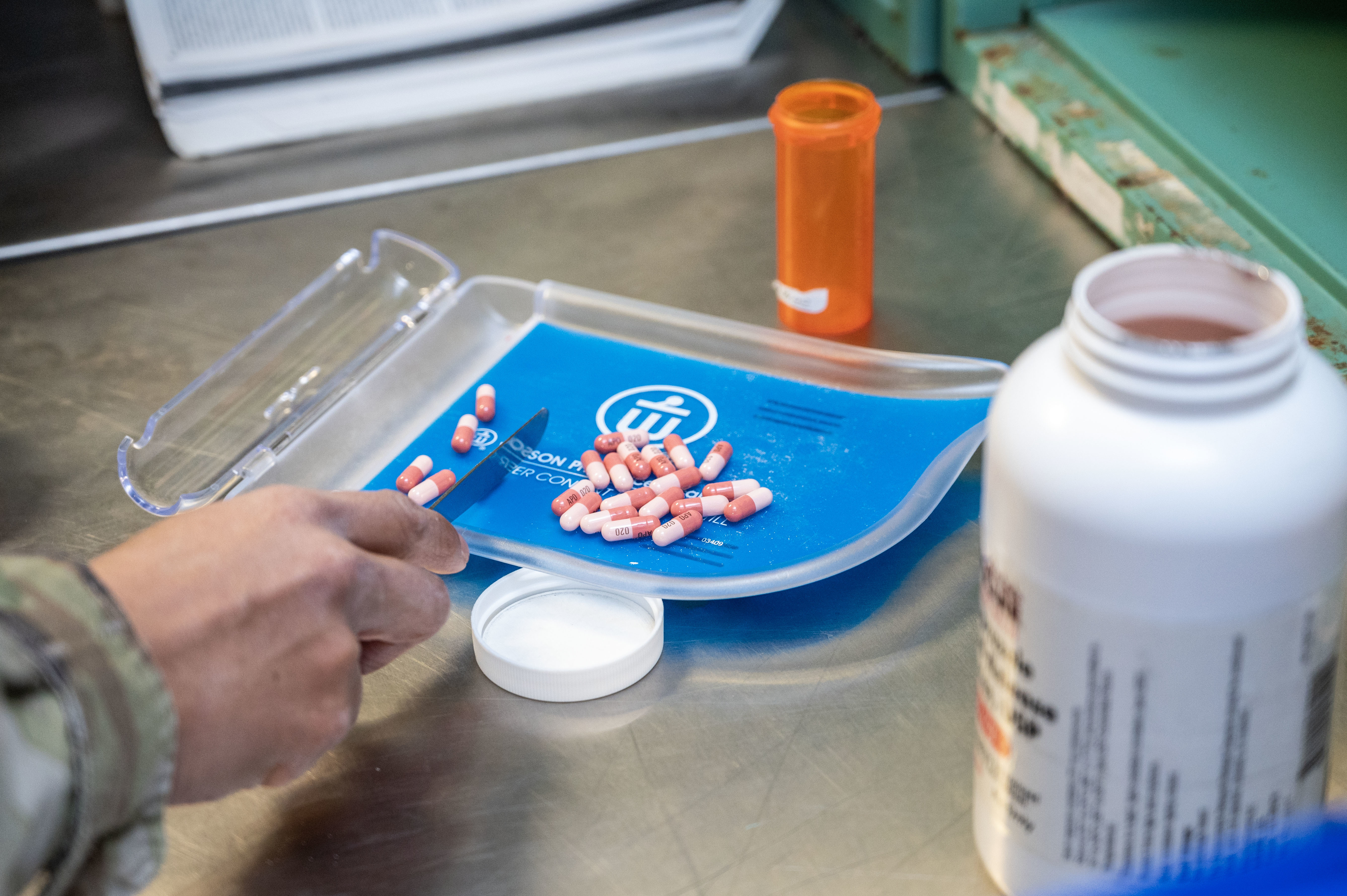 an image of a pharmacist sorting pills